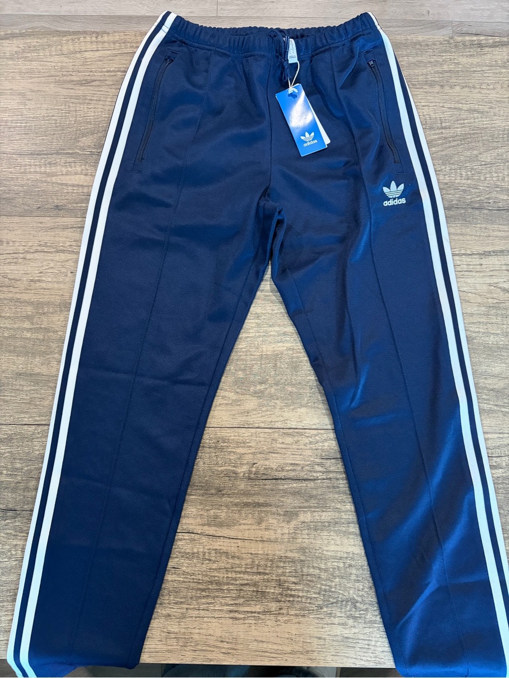 Adidas Men’s Navy Blue Track Pants with White Stripes and zipper pockets